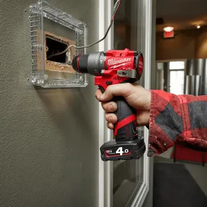 Milwaukee M12FPD 12V brushless percussion drill in professional setting