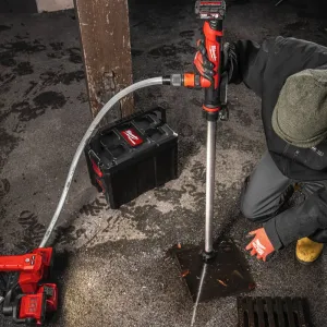 The M12™ HYDROPASS™ M12-BSWP water pump actively pumping water from a flooded trench, demonstrating its effectiveness in draining large volumes.